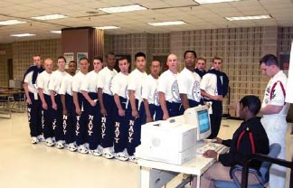 Recruits complete paperwork such as life insurance and medical records, determine family allotments and receive identification cards to establish their identity in the Navy.