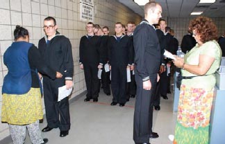 Recruits are provided Navy-issued clothing, including their personally tailored dress uniform.
