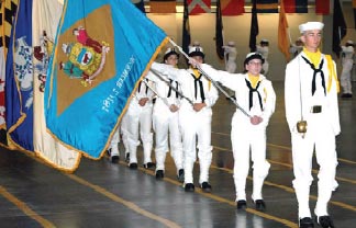 Proud family and friends congratulate sailors on graduation day.